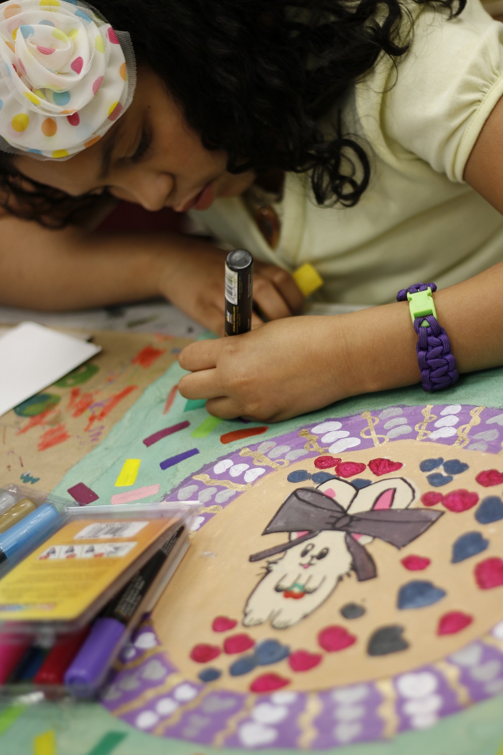 Child coloring at the inner-city neighborhood art house in erie, pa